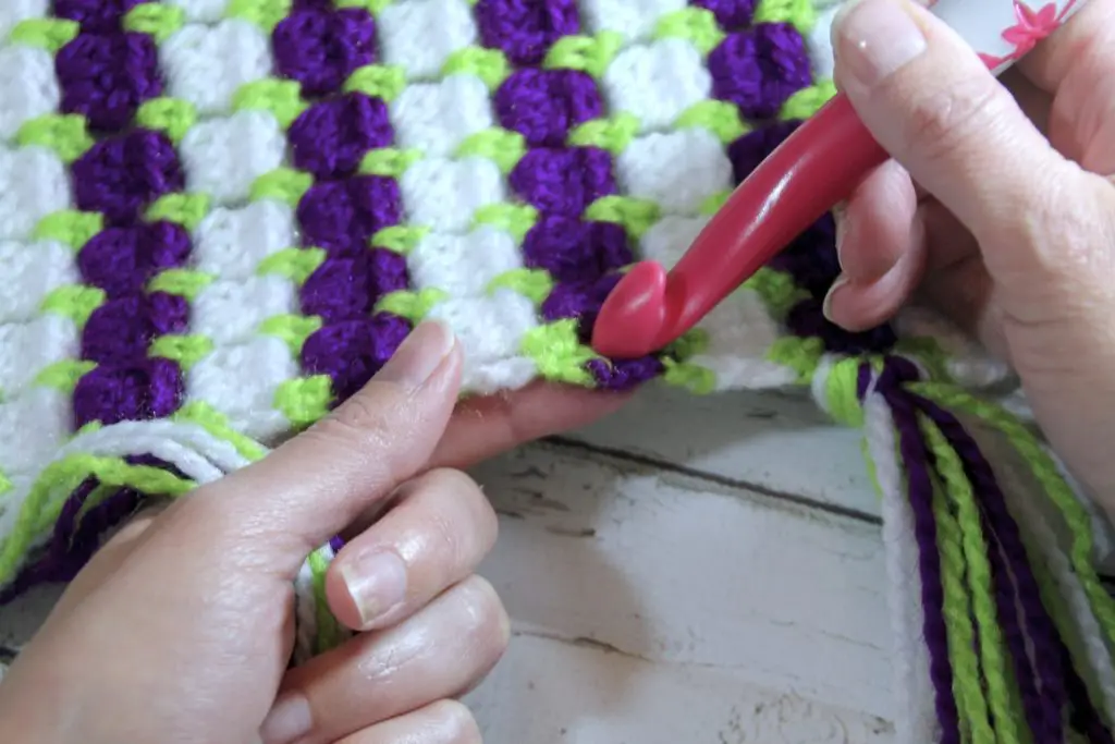 Insert Crochet Hook into desired space in project