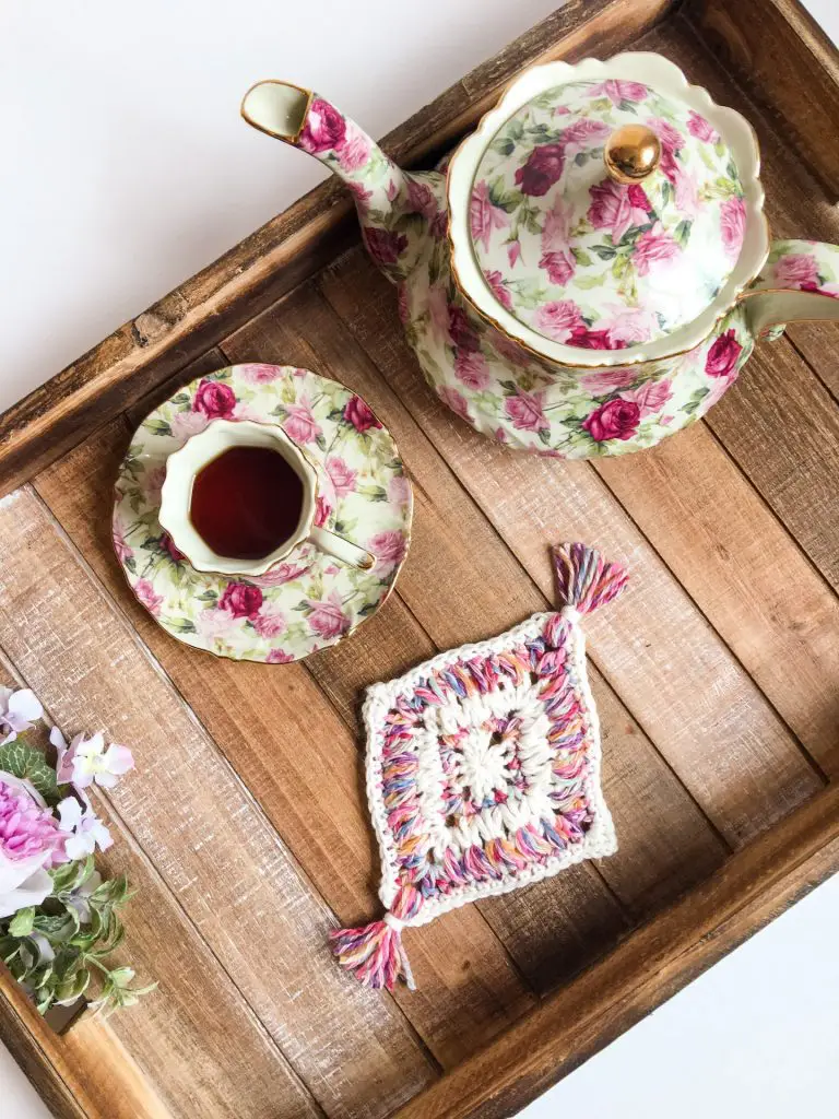 Flower Garden Diamond Coaster free crochet pattern on a tea tray